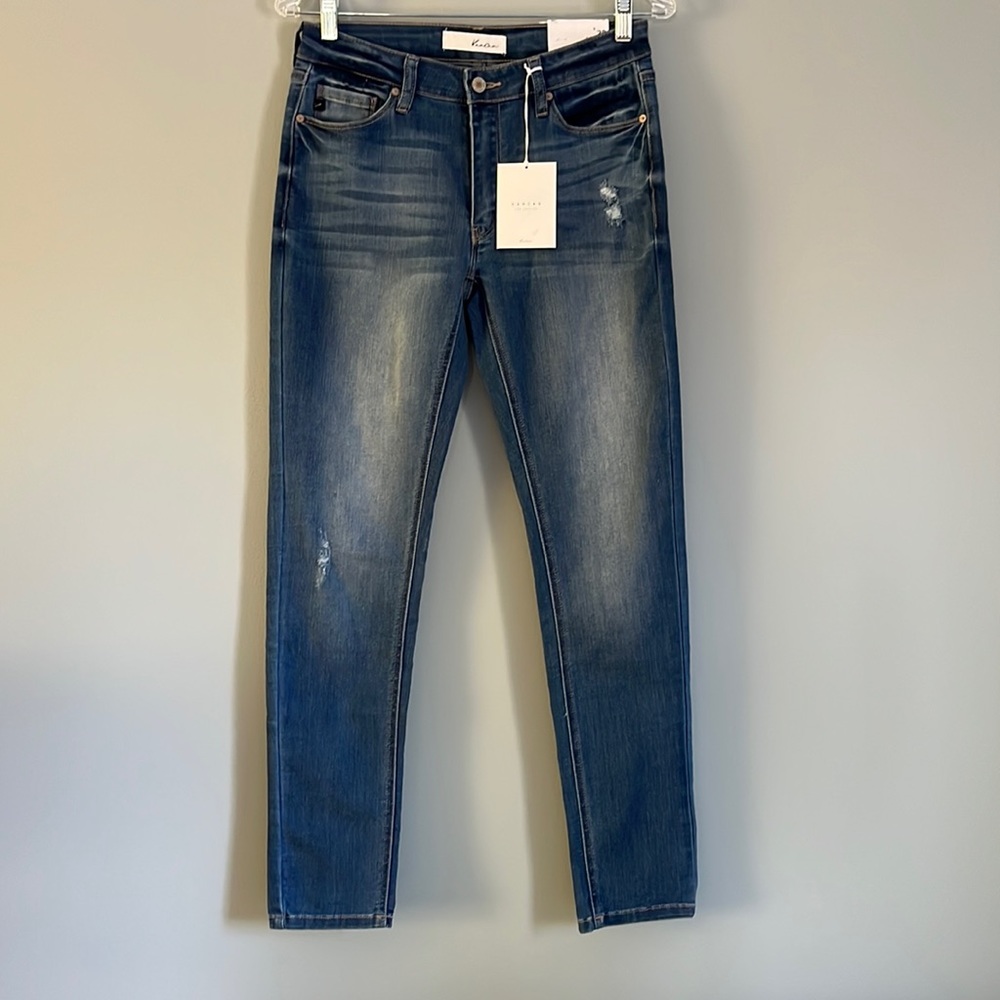 Comfortable skinny Jeans. Navy blue, with faded thighs. Small holes